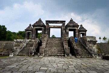 Fototapeta na wymiar Yogyakarta, Indonesia – January 16, 2020: Restored Temple Ruins Of Candi Ratu Boko Is Not A Temple, But A Remains Of A Palace. Ratu Baka Is Often Called Kraton Ratu Boko. Built During The 8th Century