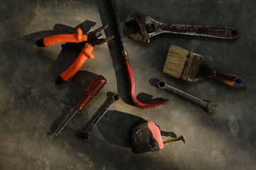 Set of assorted work tools. Various carpentry tools on wooden background.