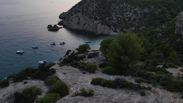 Cala Varques beach. Beautiful bay seascape. Boats in the Mediterranean Sea.