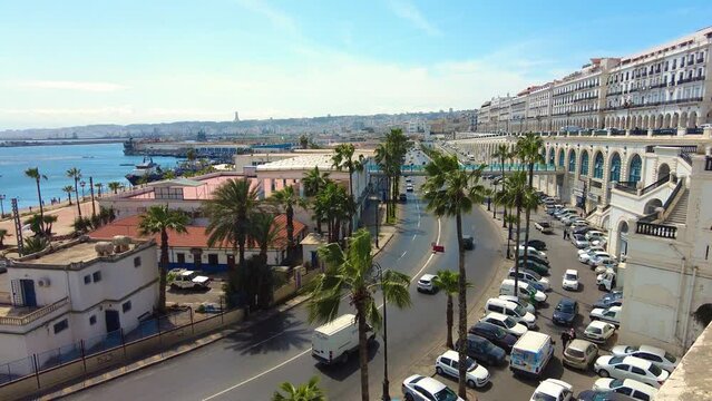 shot of the sea front road of algiers with monument of martyrs in the background
