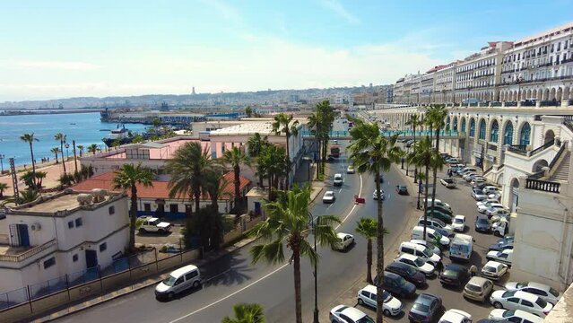 shot of the sea front road of algiers with fishing port in the background Algeria
