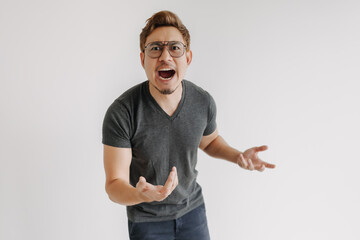 Angry and mad asian gangster with color hair and eyeglasses in black t-shirt.