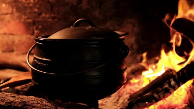 South African potjie pot cooking on the fire