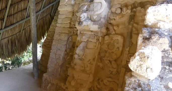 Closeup of one of the masks on the left hand side of the pyramid of the Temple of the Masks, Mayan site at Kohunlich - Quintana Roo, Mexico