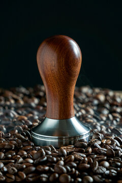tamper coffee with steam and coffee beans