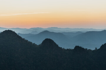 Beautiful scenery, natural landscape, morning light and mist in the valley on the high mountain of Thailand.