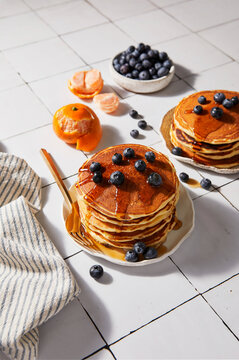 Pancake Stack on a White Tile Background with Hard Light