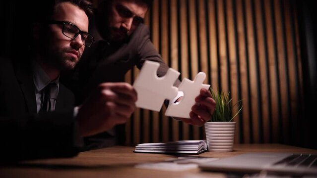 Male CEO or boss assemble brain puzzler, make decision or solve issue. Brainstorm concept.