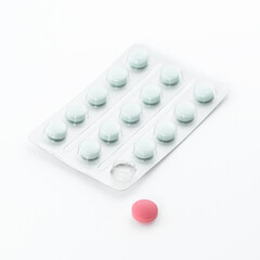 Red pill and plastic package, copy space. Health insurance and Global healthcare concept.