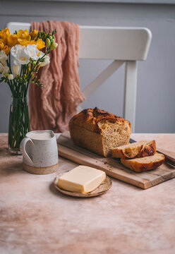 Corn bread, butter and milk on a table, served for breakfast