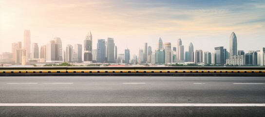 Fototapeta premium City skyline and buildings with empty asphalt road at sunrise
