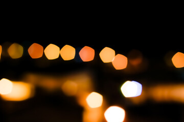 Fototapeta premium background abstract street night orange lights with bokeh effect