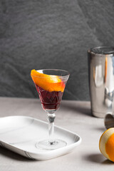 Boulevardier cocktail boozy bourbon whiskey, bitter and sweet vermouth with orange peel as garnish