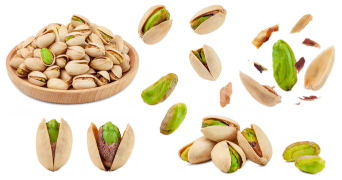 a set of unbleached pistachio nuts isolated on white background.
