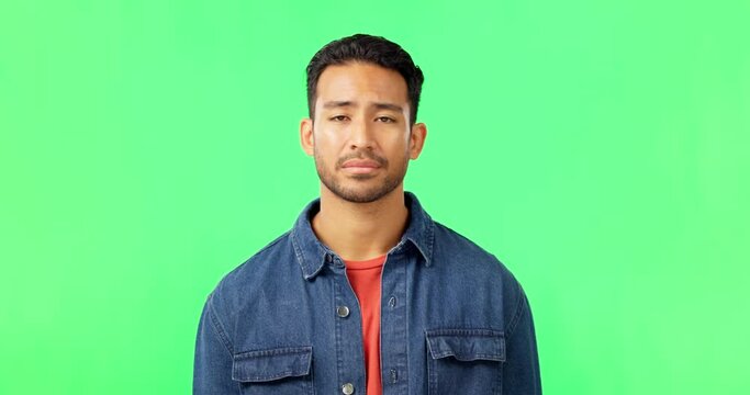 Man, portrait and green screen or unhappy and shaking head for bad rating, review or feedback. Face of asian male on studio background for no, disappointment and bad news or rejection and opinion
