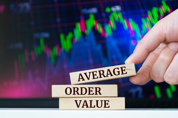 Wooden blocks with words 'AVERAGE ORDER VALUE'. Business concept