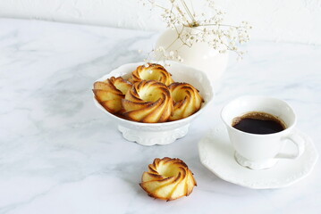 Breakfast with coffee cup , cottage cheese muffins cupcakes in a plate on the marble  table . Copy space.Delicious homemade curd muffins. Sweet baked pastry.