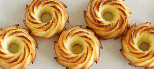 Cottage cheese muffins cupcakes close up set top view banner. Delicious homemade curd muffins. Sweet baked pastry. 
