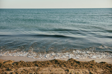 peaceful, calm seascape at sunset in sunny weather