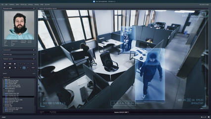 Playback office CCTV camera on computer. People work in coworking office. AI software with facial...