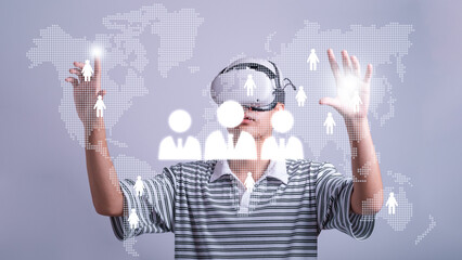 Man use vr glasses and looks at world map metaverse technology, studio shot.Virtual gadgets for entertainment, work, free time and study. game cyber Virtual reality technology concept.