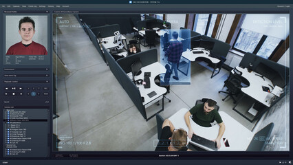 Playback office CCTV camera on computer. People work in coworking office. AI software with facial...