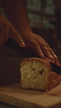 slicing bread in the kitchen