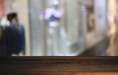 Empty wooden table in front of abstract blurred background of coffee shop . can be used for display or montage your products.Mock up for display of product