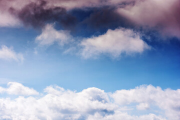 blue sky with fluffy clouds on a sunny day. beautiful nature background