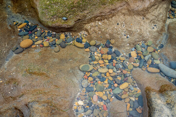pebbles under water at low tide