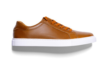 Brown leather hipster sneakers with white soles. Isolated on white background with shadow. Side...