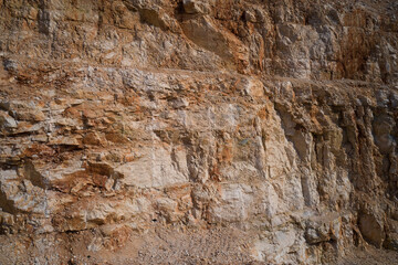Marble quarries. Brown marble quarries. Italian marble quarries. Quarry section. Quarry wall in the mountains.