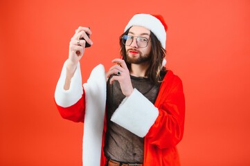 New Year's LGBT party. A gay man in a Santa suit. Concept of Equality.