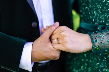 Afghani couple's holding hands close up