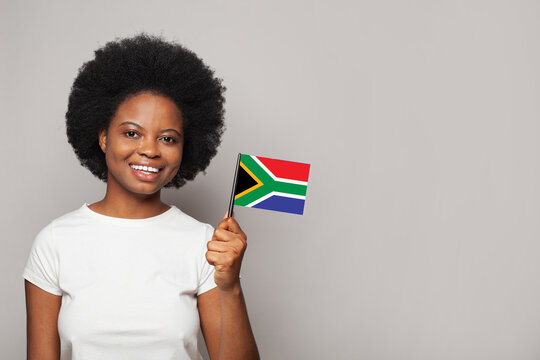South African woman holding flag of South Africa Education, business, citizenship and patriotism concept