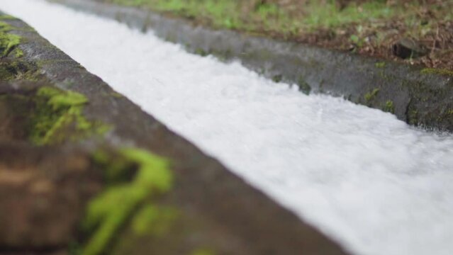 Slow motion of water running in  irrigation system of Madeira - levada