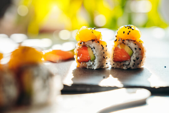 Close up of tasty japanese uramaki sushi with salmon