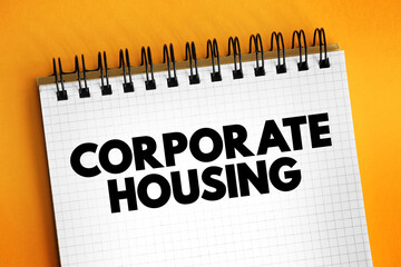 Corporate housing - term in the relocation industry that implies renting a furnished apartment, condo, or home on a temporary basis to individuals, text concept on notepad