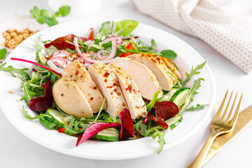 Chicken breast grilled and fresh vegetable salad