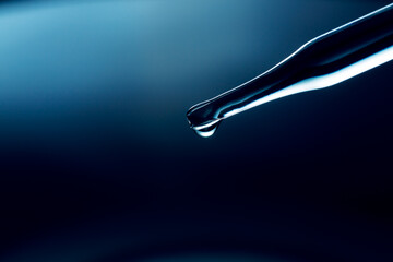 Blue macro science experiment pipette surface,Macro shot of gel with different sized tiny bubbles...