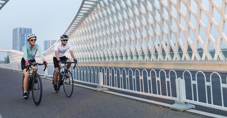 Young couples in the outdoor cycling