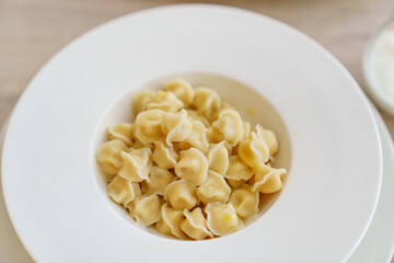 small baby dumplings in a white deep plate. the children's menu.