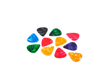 Plastic picks of different colors for playing acoustic or electric guitar.