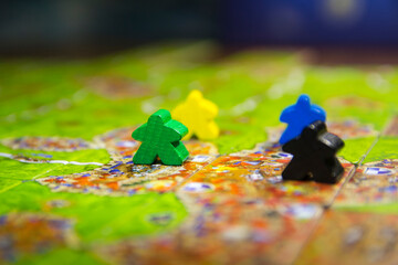 Board game carcassonne with chips close-up