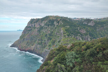 View from a height of the green island of Madeira in the ocean in the morning.