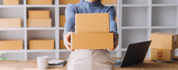 Entrepreneurs Small Business SME Independent men work at home Use smartphones and laptops for...