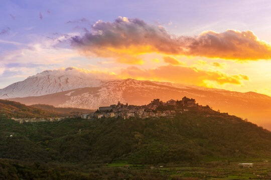 beautiful travel mountain landscape, nice sunset with amazing view from highland to a valley with picturesque mountain town