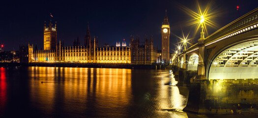 Fototapeta na wymiar Night in London, Big Ben and Palace of Westminster over River Thames, London, England