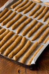 Homemade wholemeal breadsticks with fennel and organic extra virgin olive oil cooked in a wood-burning oven