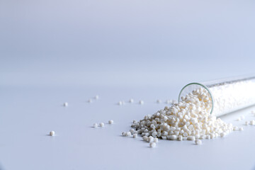 Small pieces of crushed plastic. Crushed bottle caps for recycling. Plastic waste that will be...